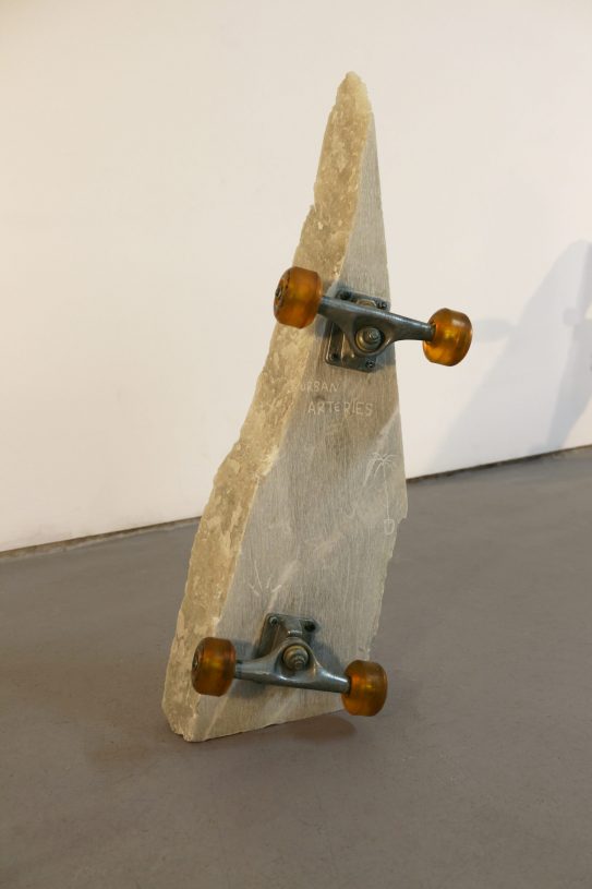 Anestis Ioannou, <i>New Sun IV (urban arteries)</i>, 2022, skateboard trucks and wheels on marble, 70x20x8 cm