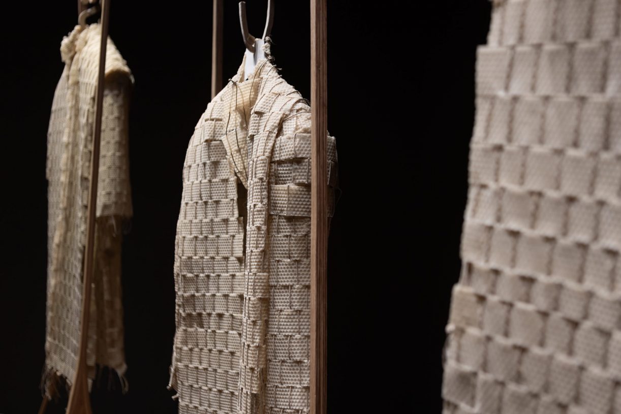 Maria Louizou, <i>Dwellings</i>, 2025, beeswax woven on a loom and handmade oak wood, approx. 130x85x10 cm and wooden frame approx. 190x100x85 cm